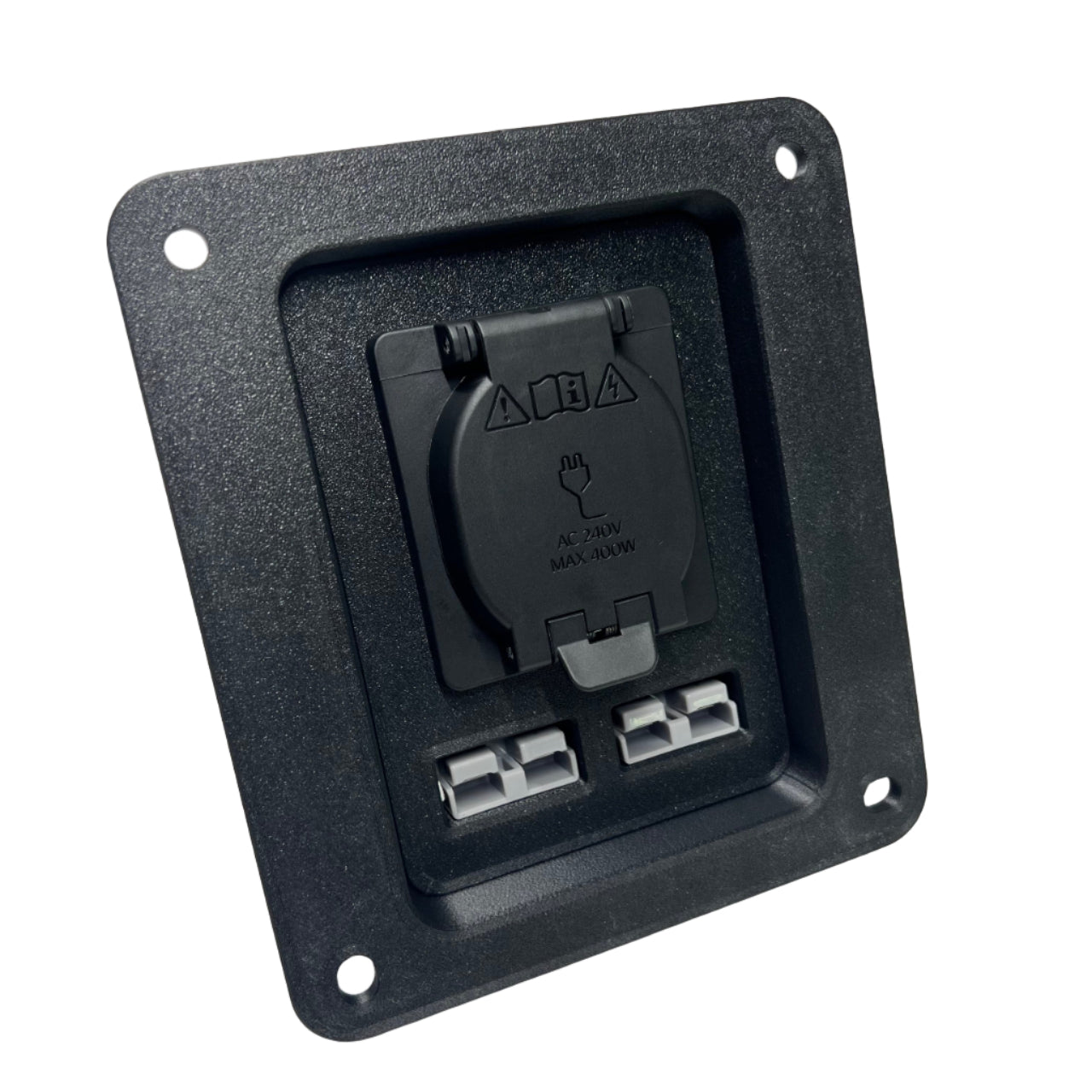 Black accessory panel with a 240V socket with protective cover closed and two 50A anderson plugs on a white surface